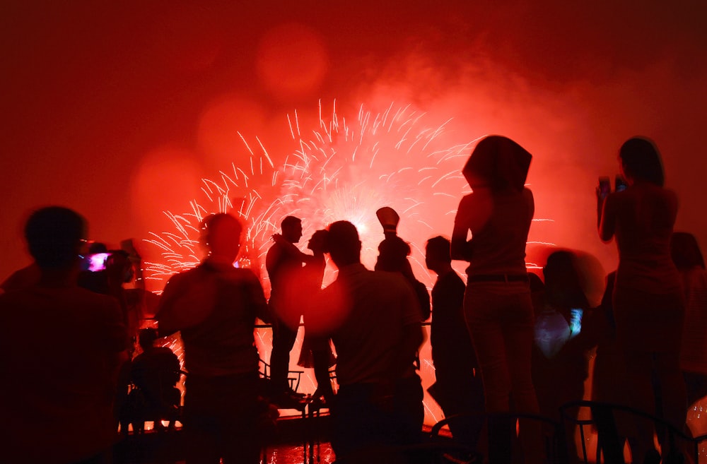 a group of people watching a fireworks display