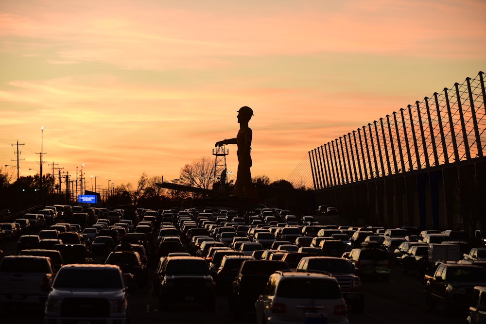 a man standing in the middle of a parking lot