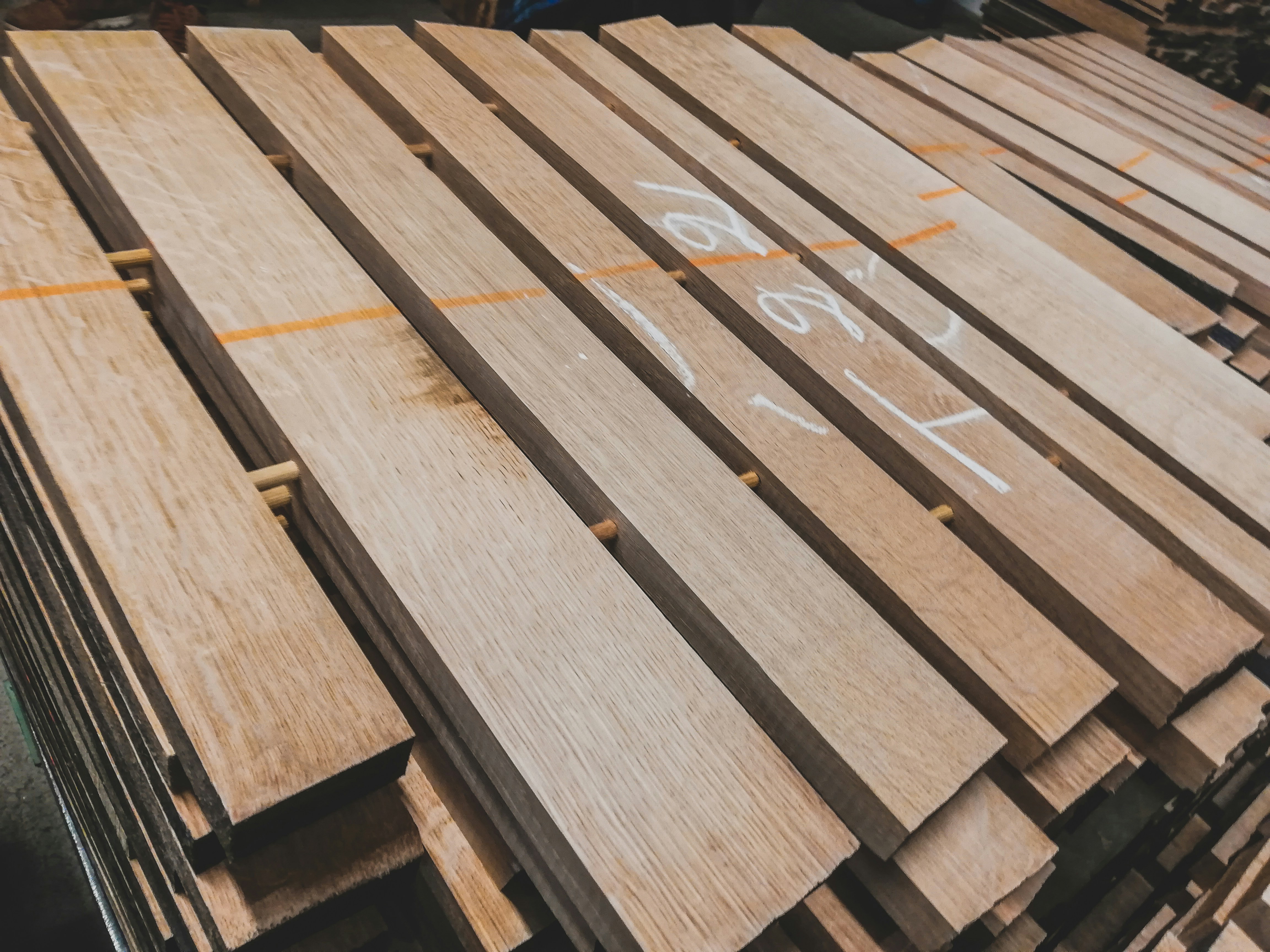 Various high-quality marine construction materials like vinyl sheeting, composite decking, and pressure-treated timber laid out for a construction project - storm damage marine repair
