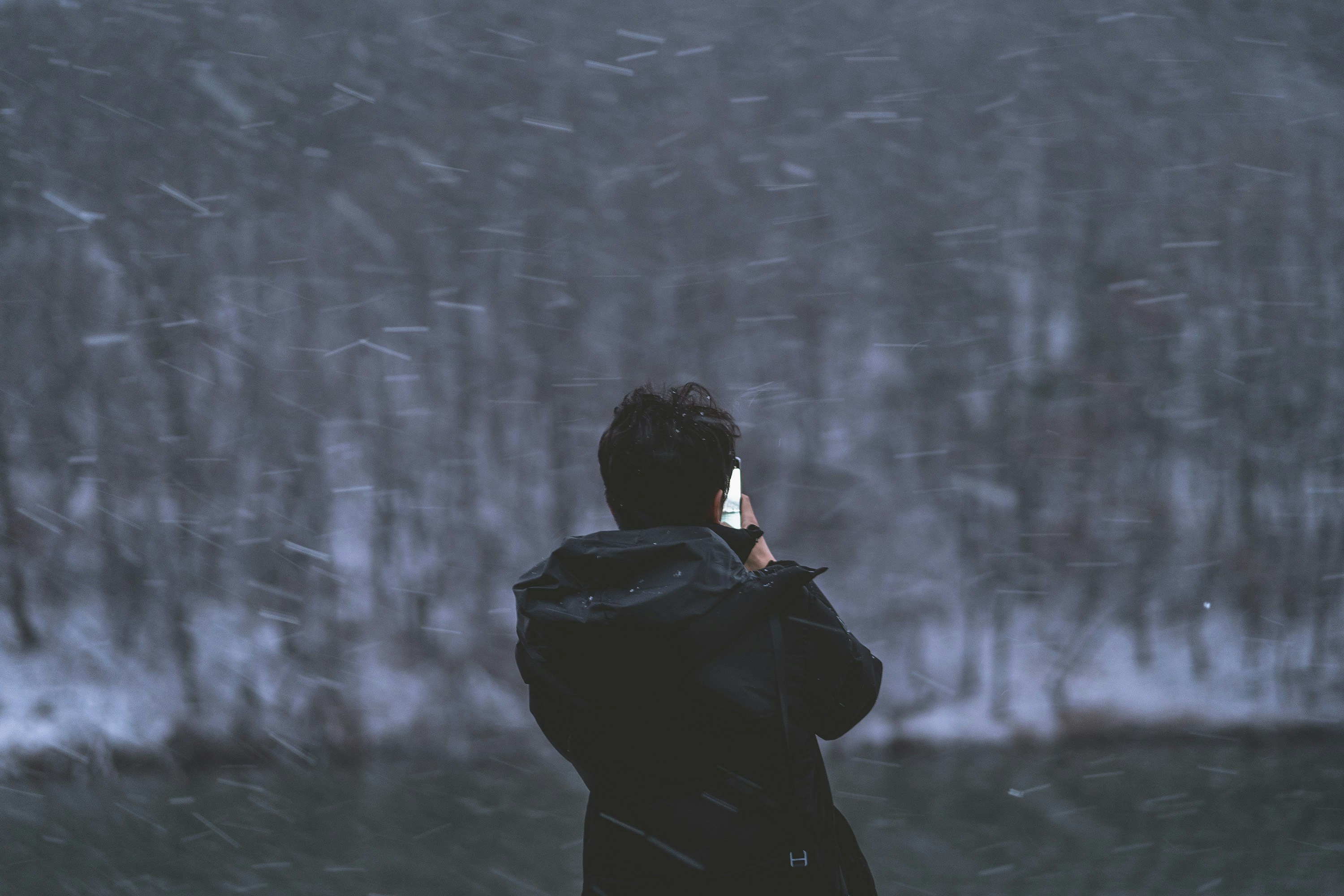 a person taking a picture with a cell phone