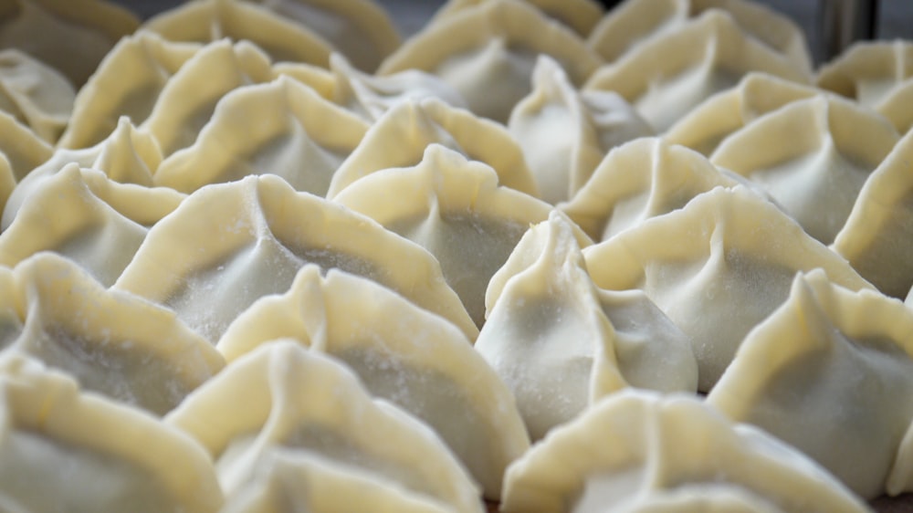 a close up of some dumplings in a pan