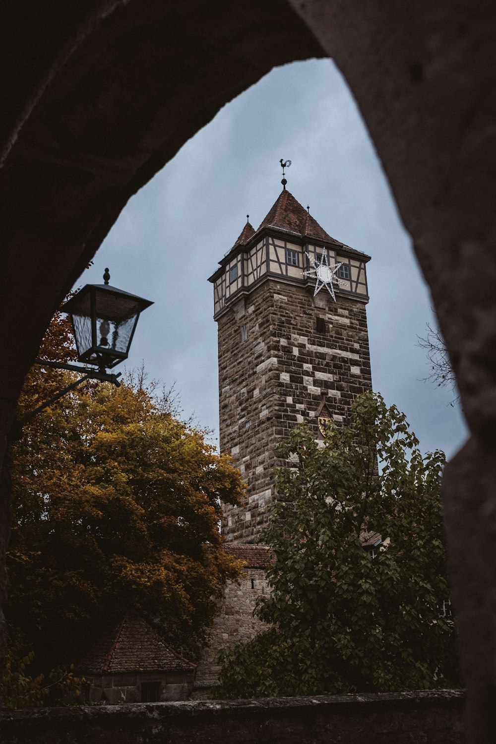 a tall tower with a clock on it's side