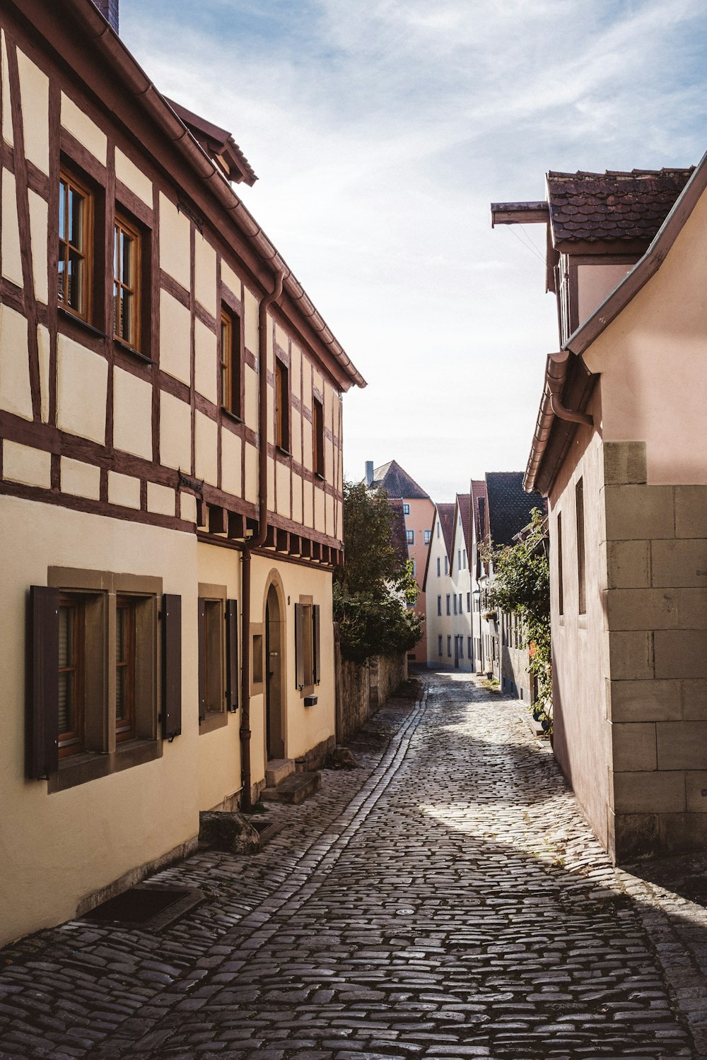 a cobblestone street in a small town