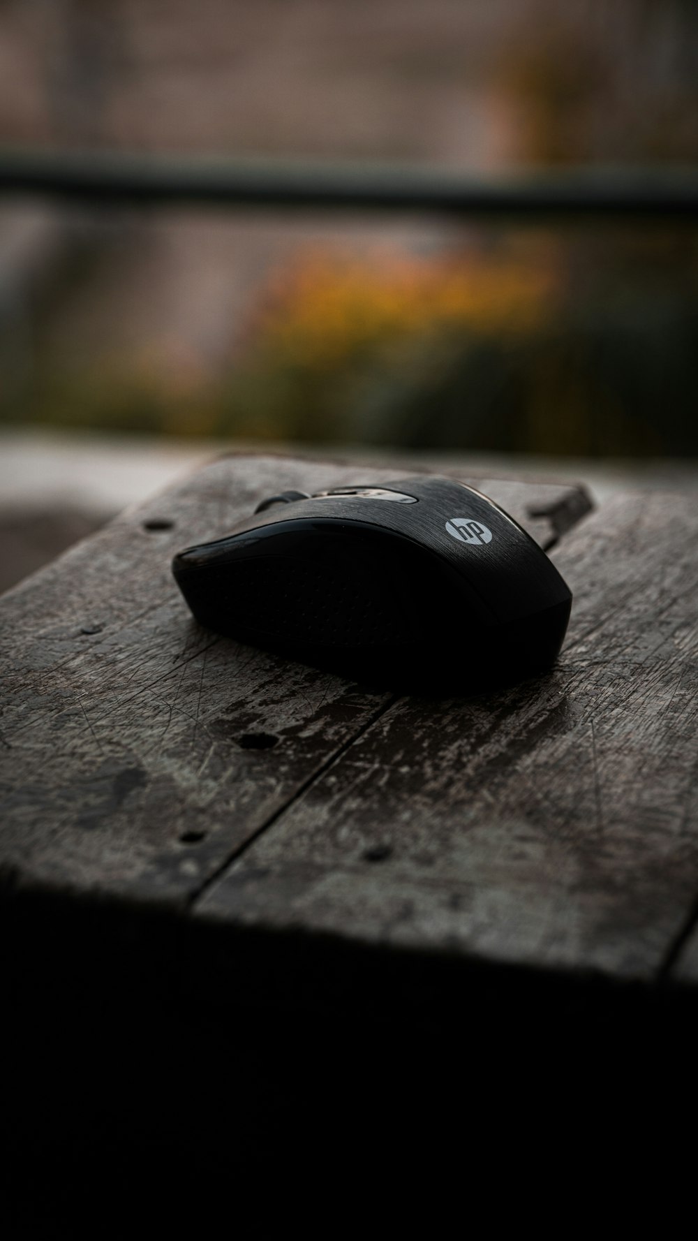 a computer mouse sitting on top of a wooden table