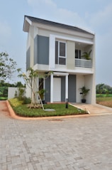 Front exterior view of a modern two-bedroom rental property with tidy landscaping.