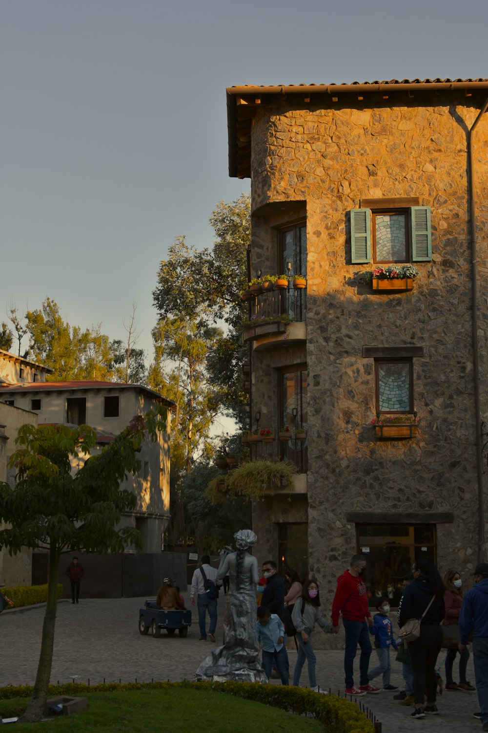 a group of people standing in front of a building