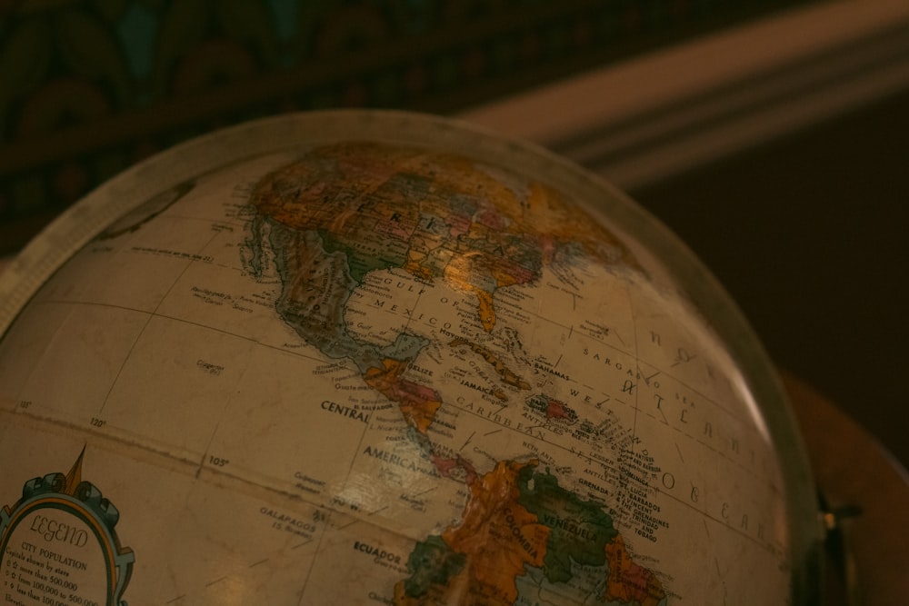 a close up of a globe on a table