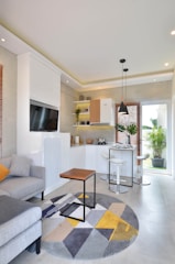 a living room filled with furniture and a flat screen tv