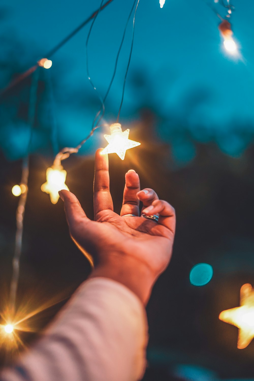 a person holding a star in their hand