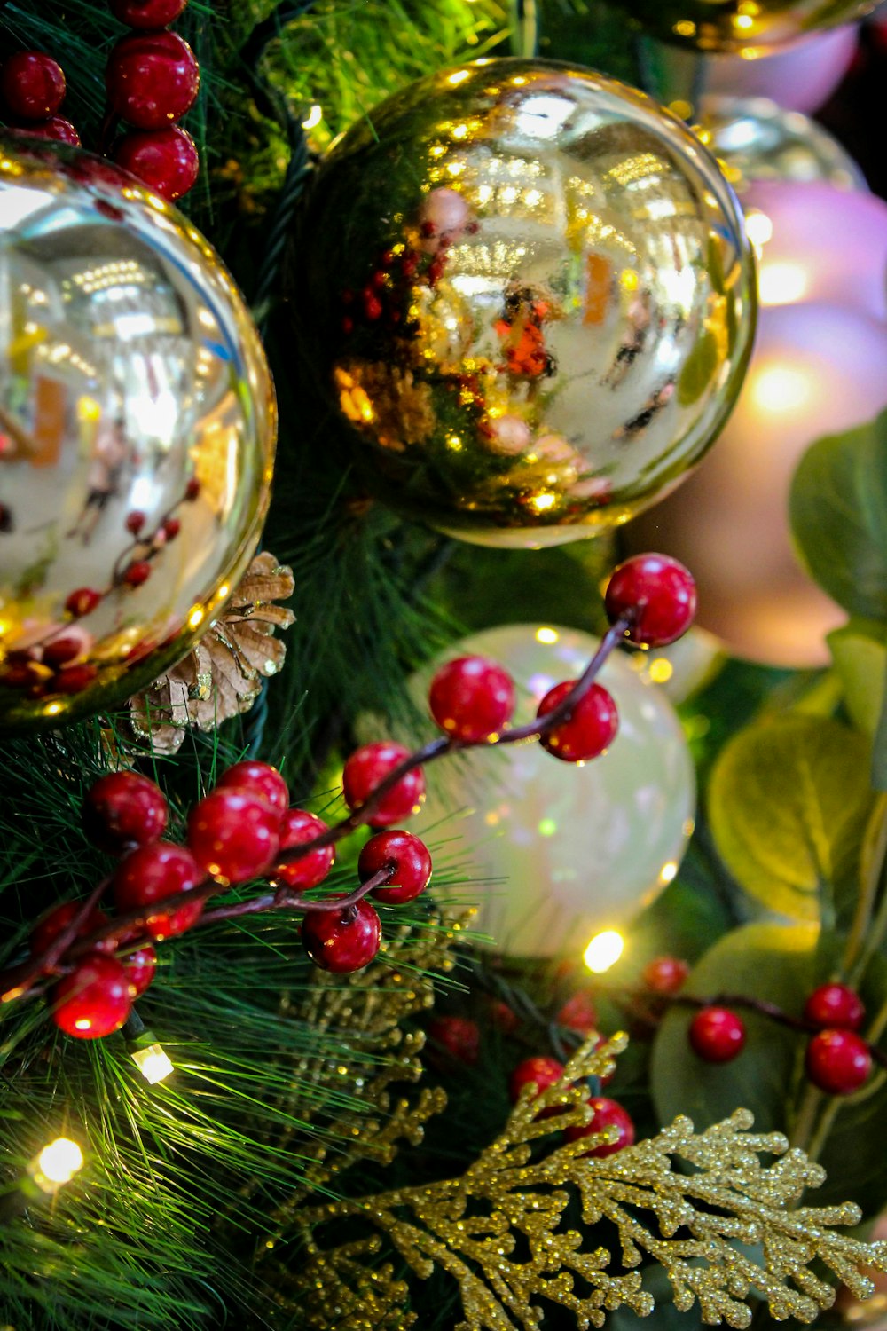 a close up of a christmas tree with ornaments