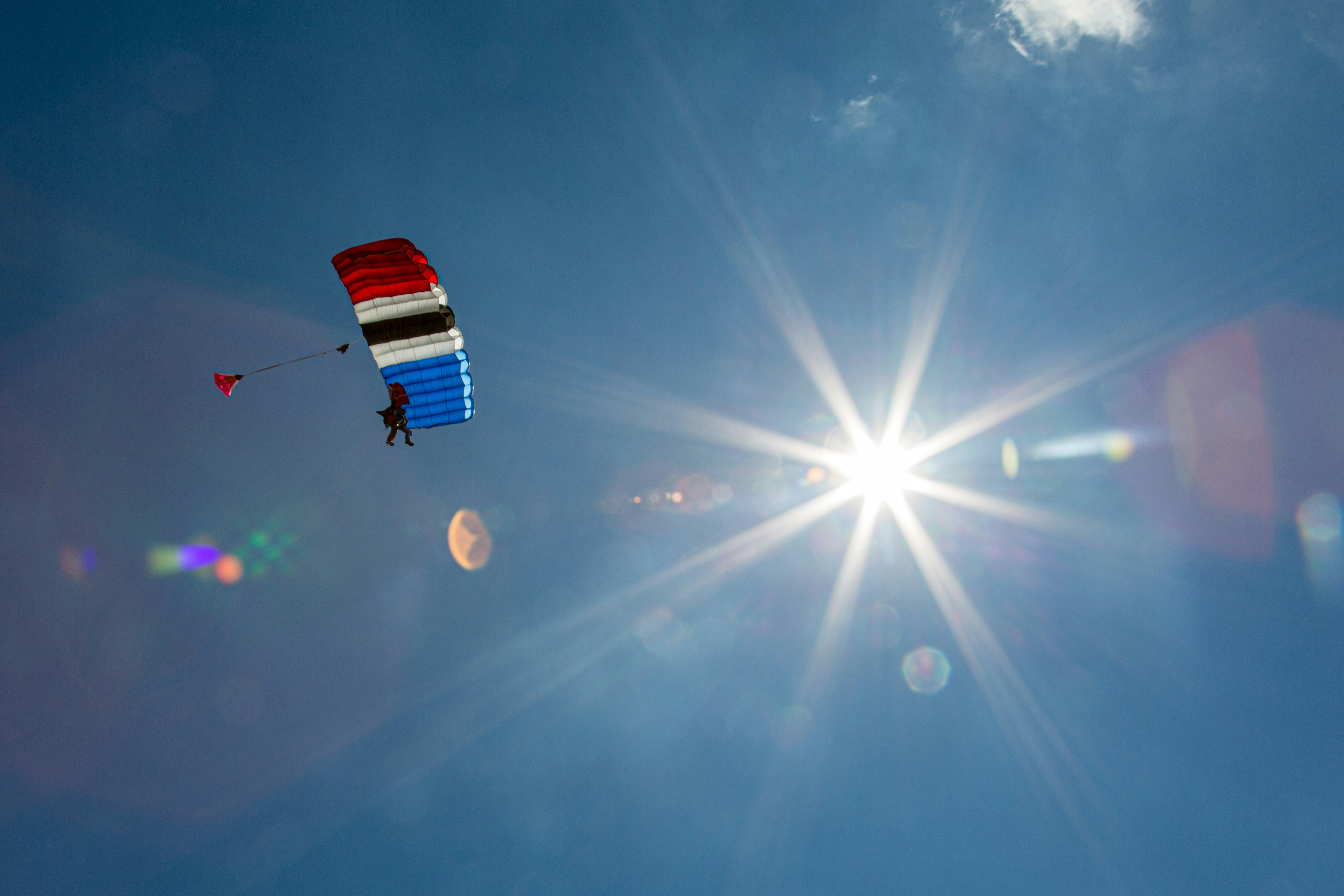 a person is flying a kite high in the sky