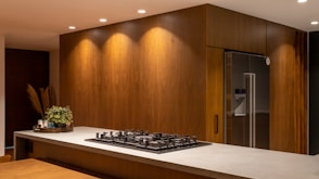 a kitchen with a stove and a refrigerator