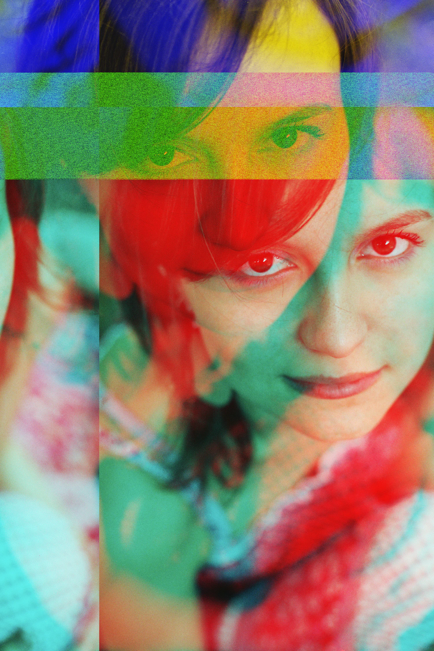 A face lit by overlapping red and green light inside a paper set