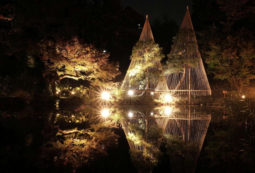 a reflection of lights in a pond at night