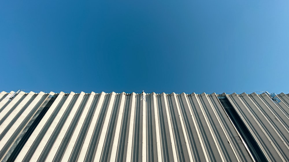 a metal roof with a blue sky in the background