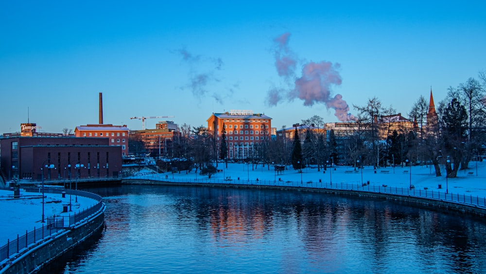 a river running through a snow covered city