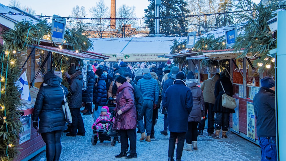 a group of people standing around a market