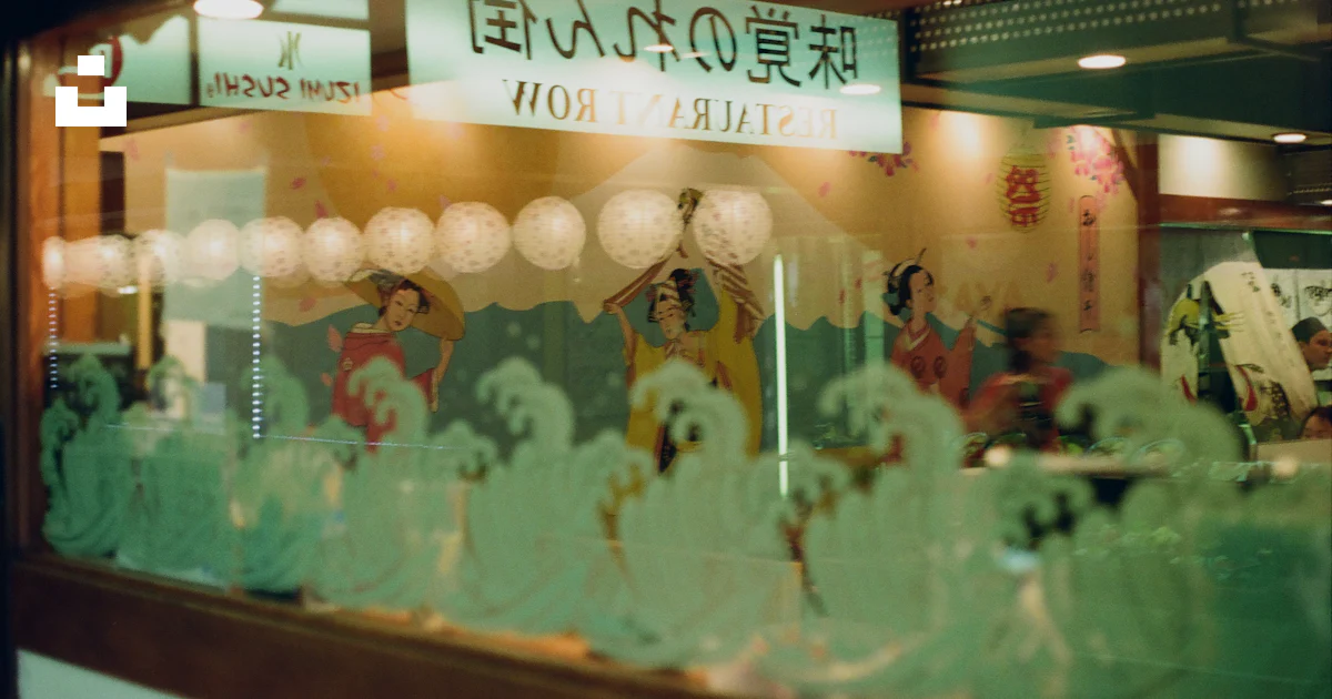 Asian Window Display A window display of a restaurant with asian writing on it photo – Free ...