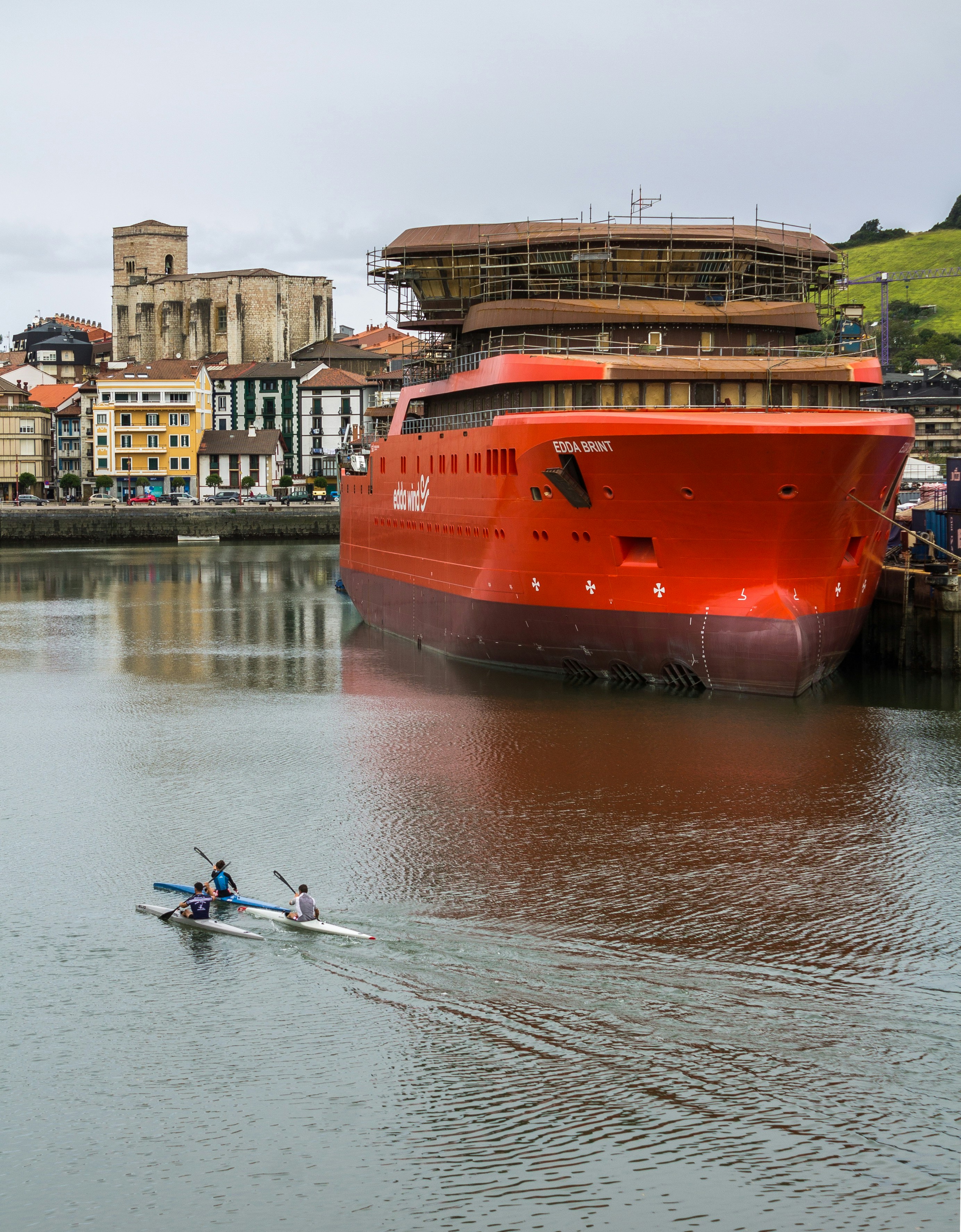 A large red boat in a body of water photo – Free Vehicle Image on Unsplash
