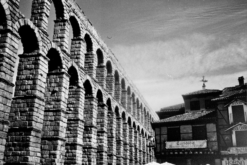 a black and white photo of a brick wall