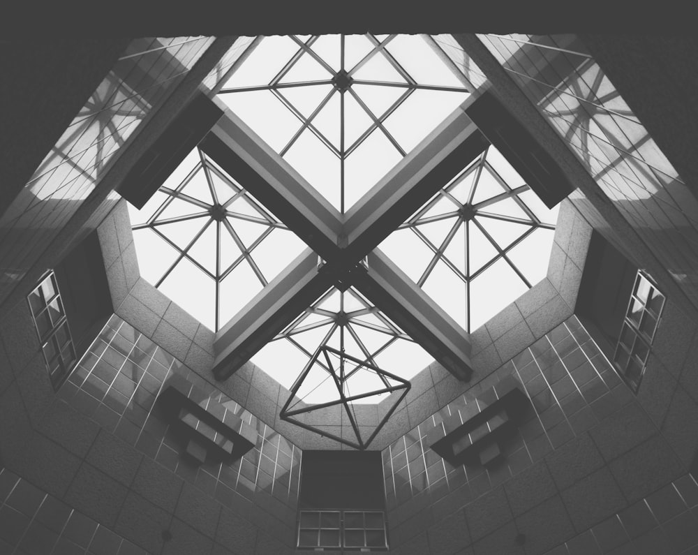 a black and white photo of the ceiling of a building