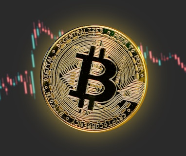 a bitcoin is shown in front of a stock chart