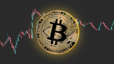 a bitcoin is shown in front of a stock chart