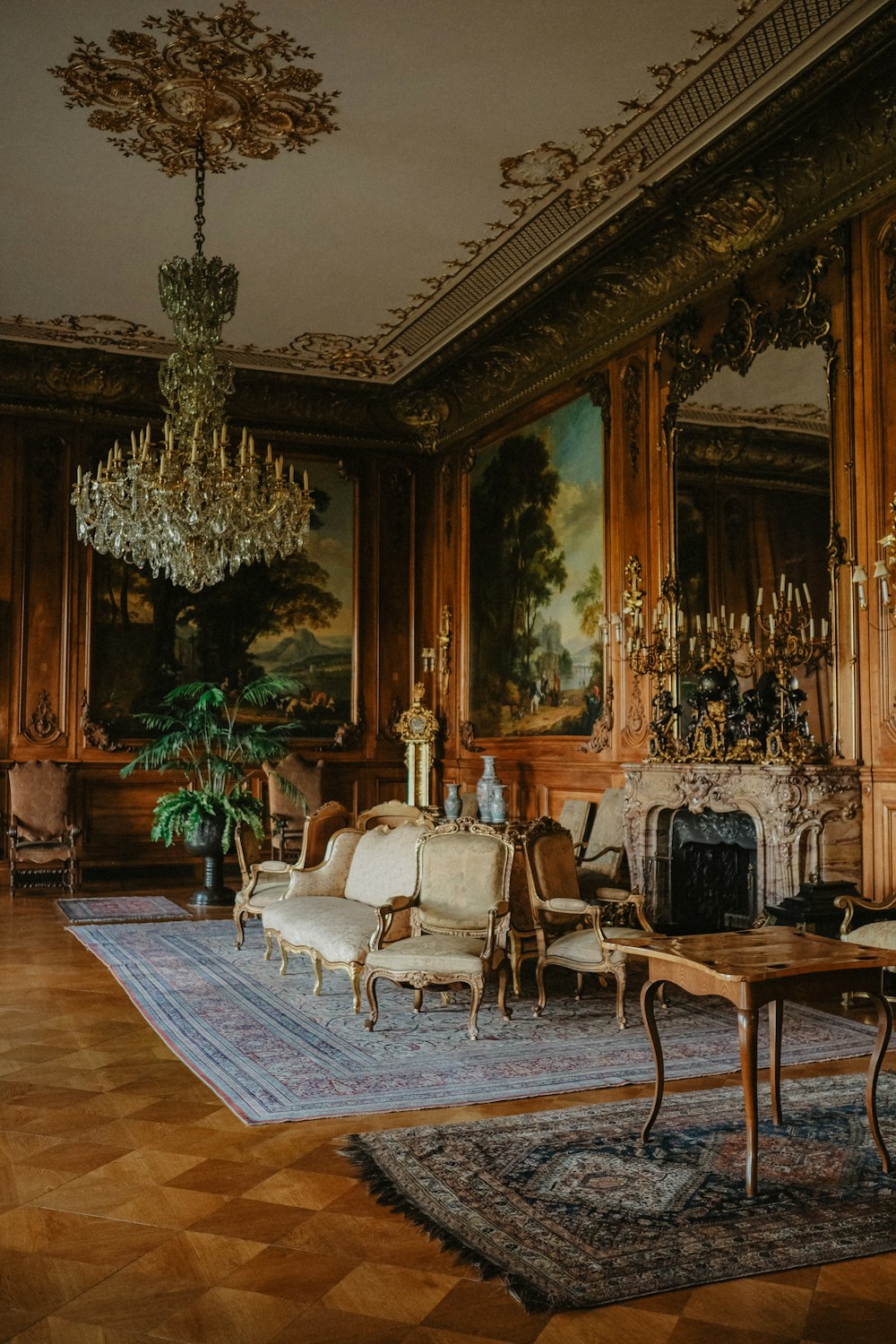 a living room filled with furniture and a chandelier