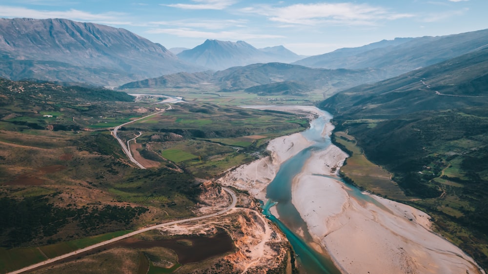 an aerial view of a river running through a valley