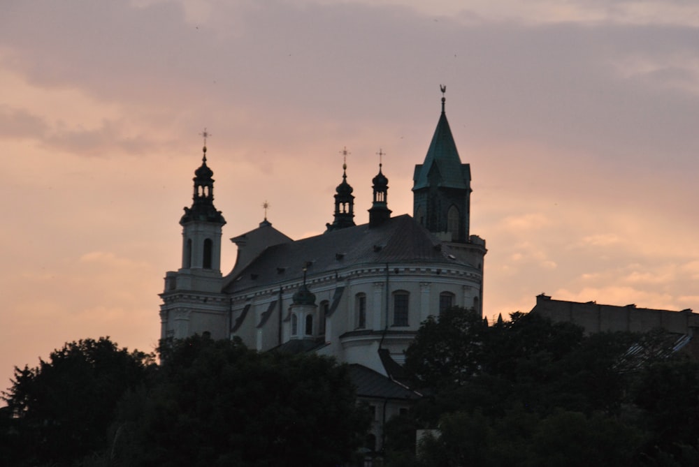 a large building with two towers and two spires