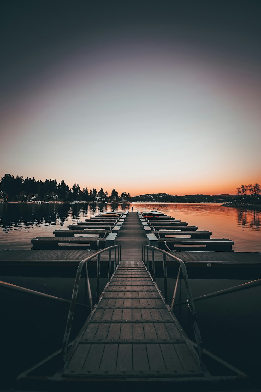 a dock with many boats in the water