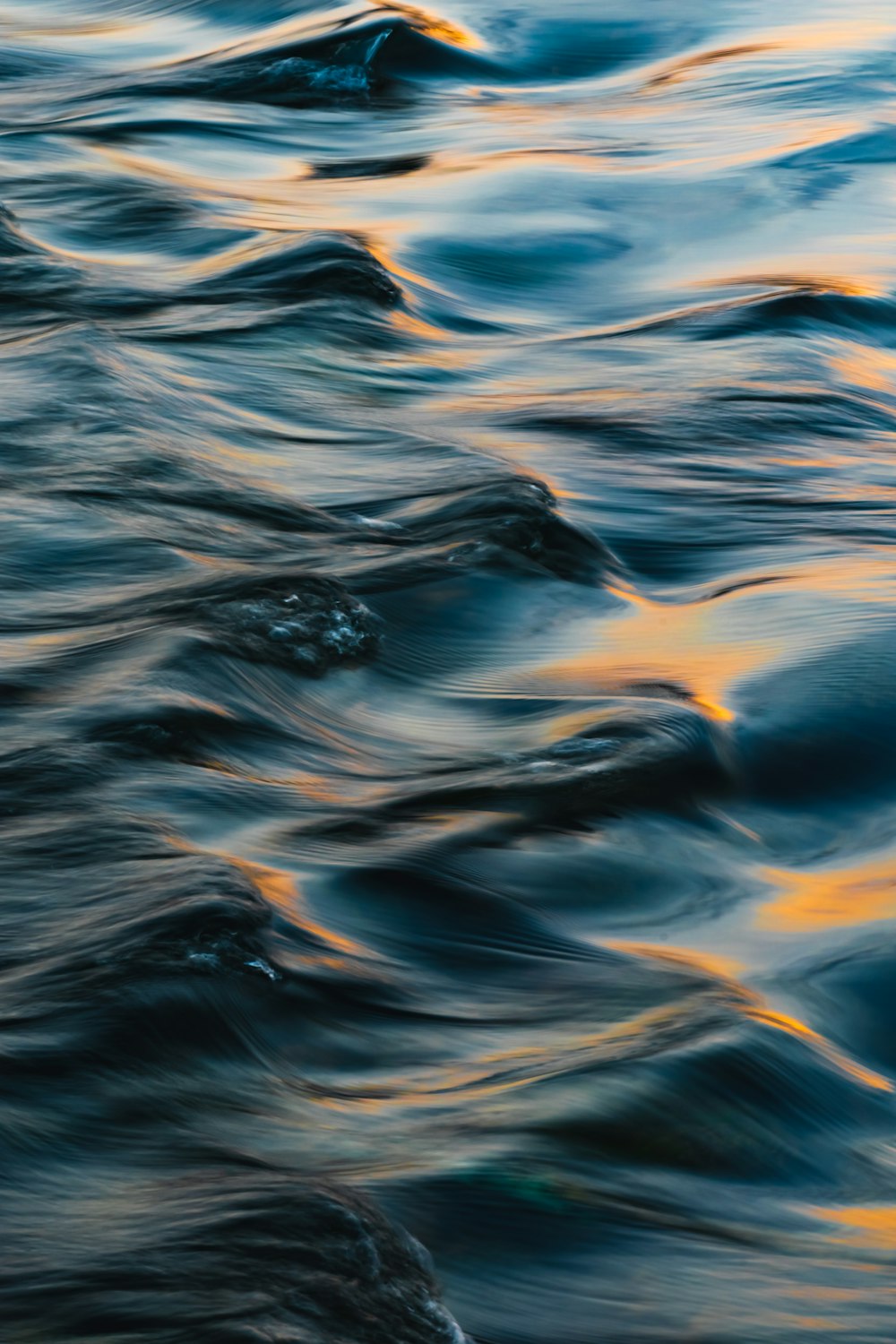 a close up of a body of water with waves