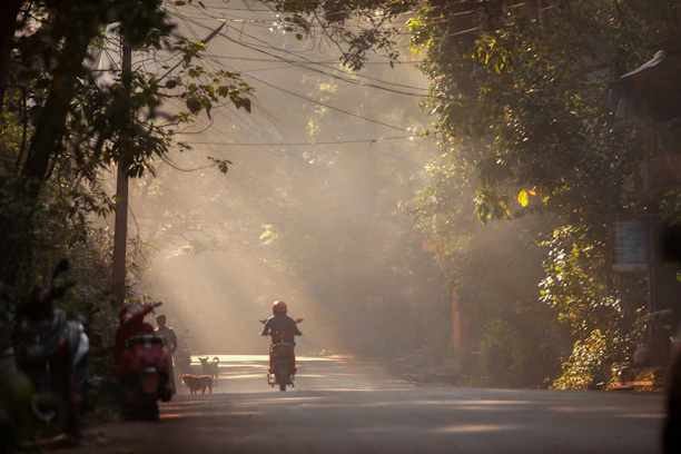 a person riding a motorcycle down a street