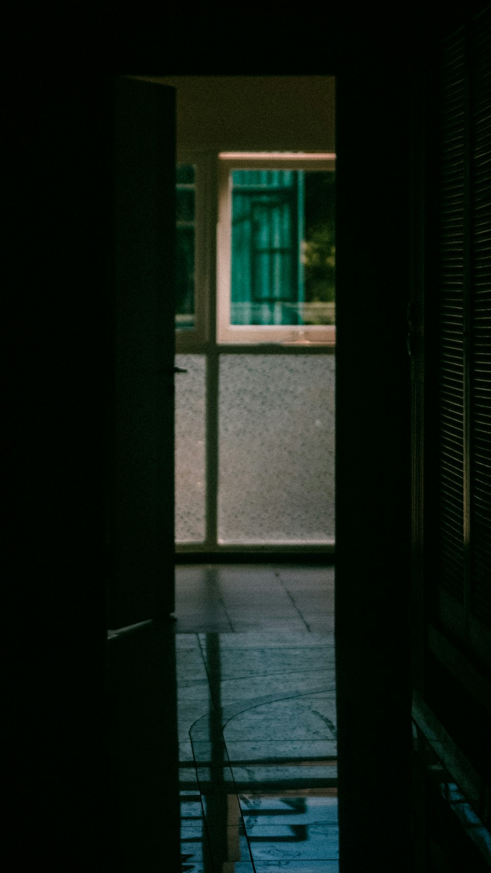 an open door leading into a dark room