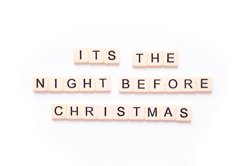 the words it's the night before christmas spelled with scrabble blocks