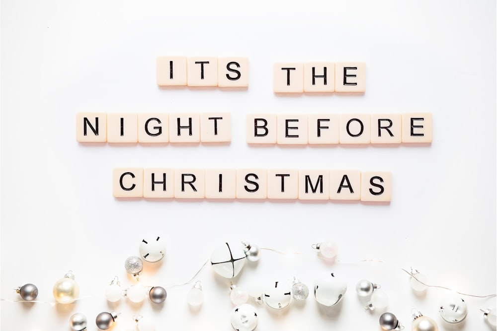 scrabble letters spelling it's the night before christmas