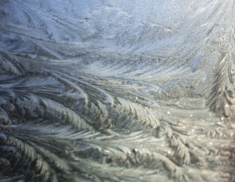 a close up view of a frosty window