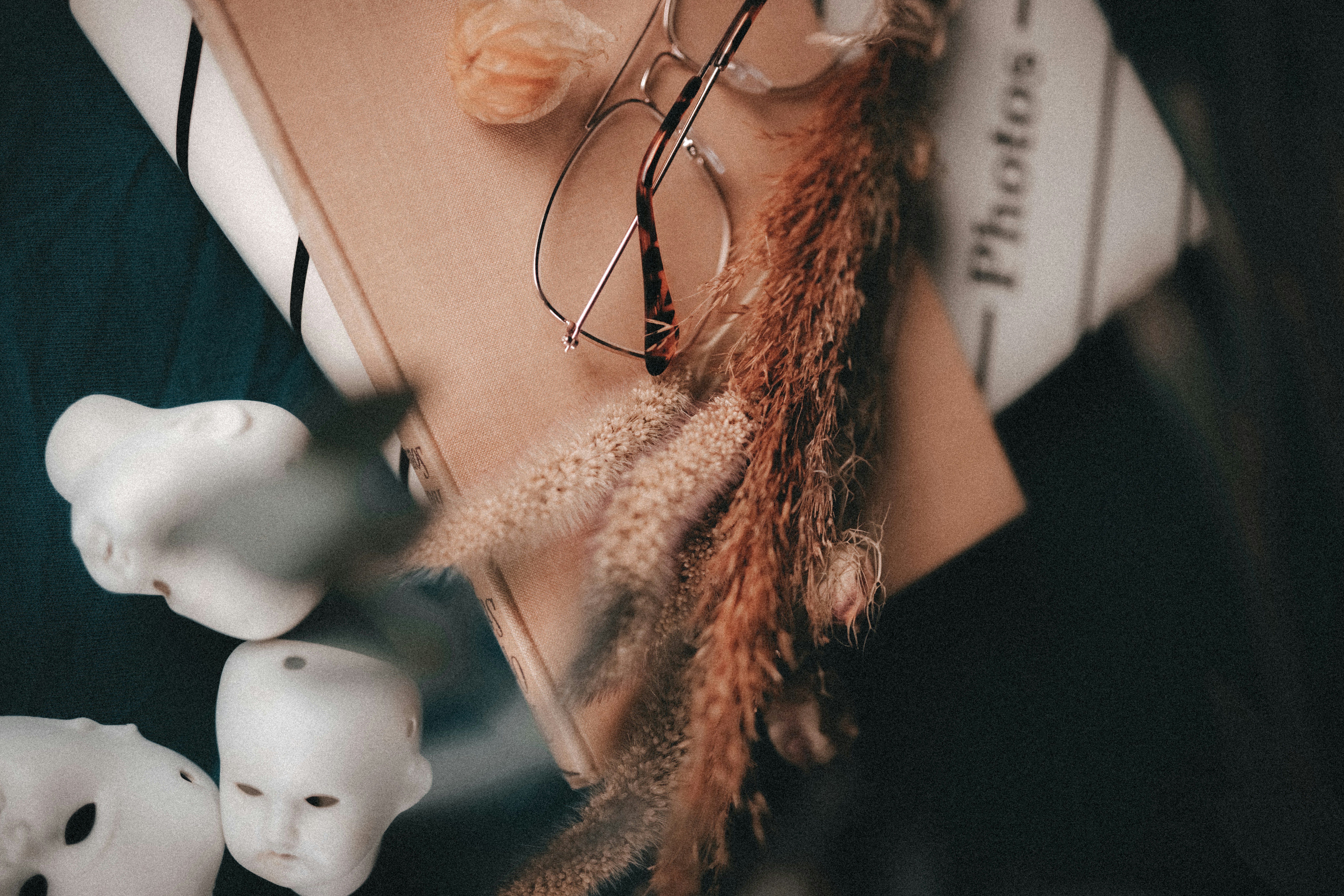 a pair of glasses sitting on top of a book