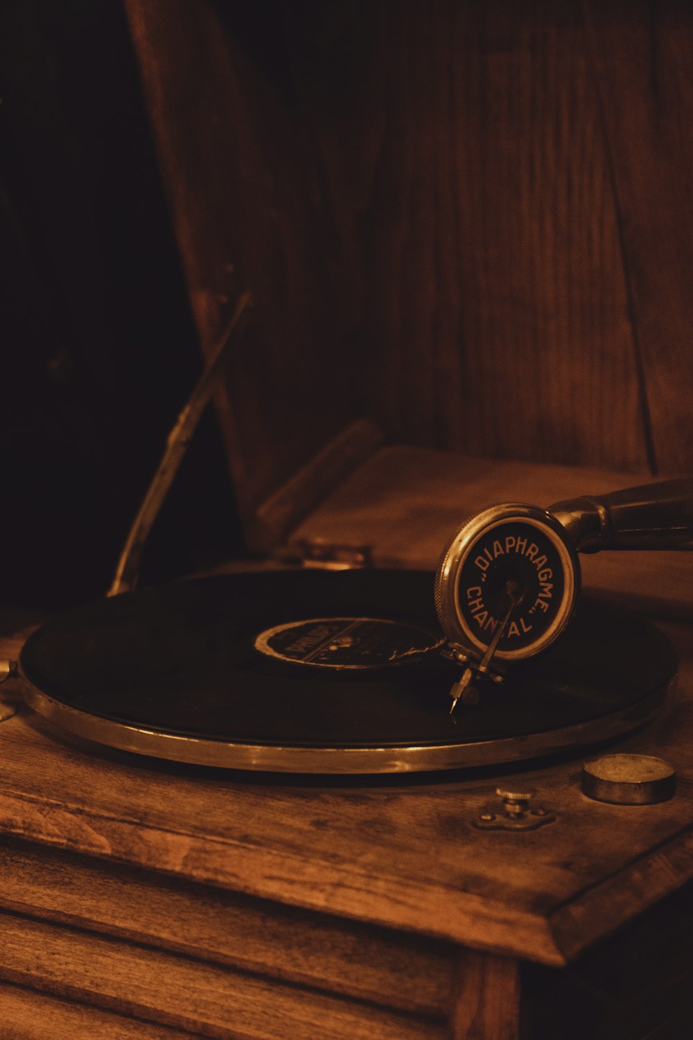 a record player sitting on top of a wooden table