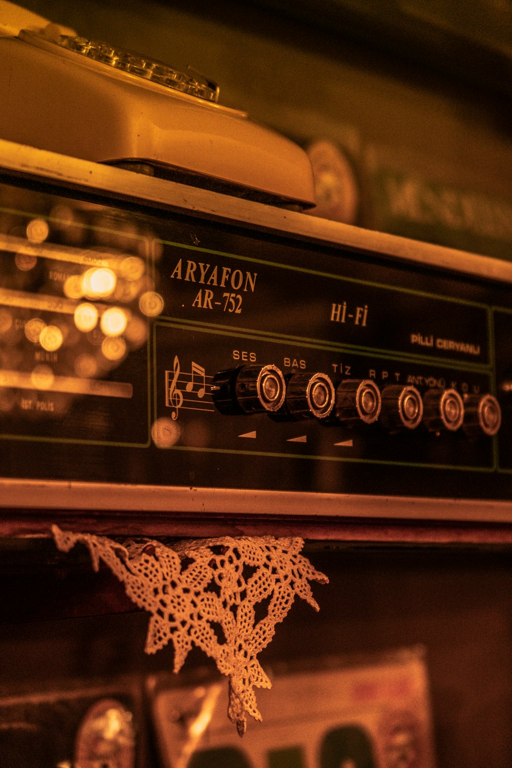 a radio sitting on top of a wooden shelf