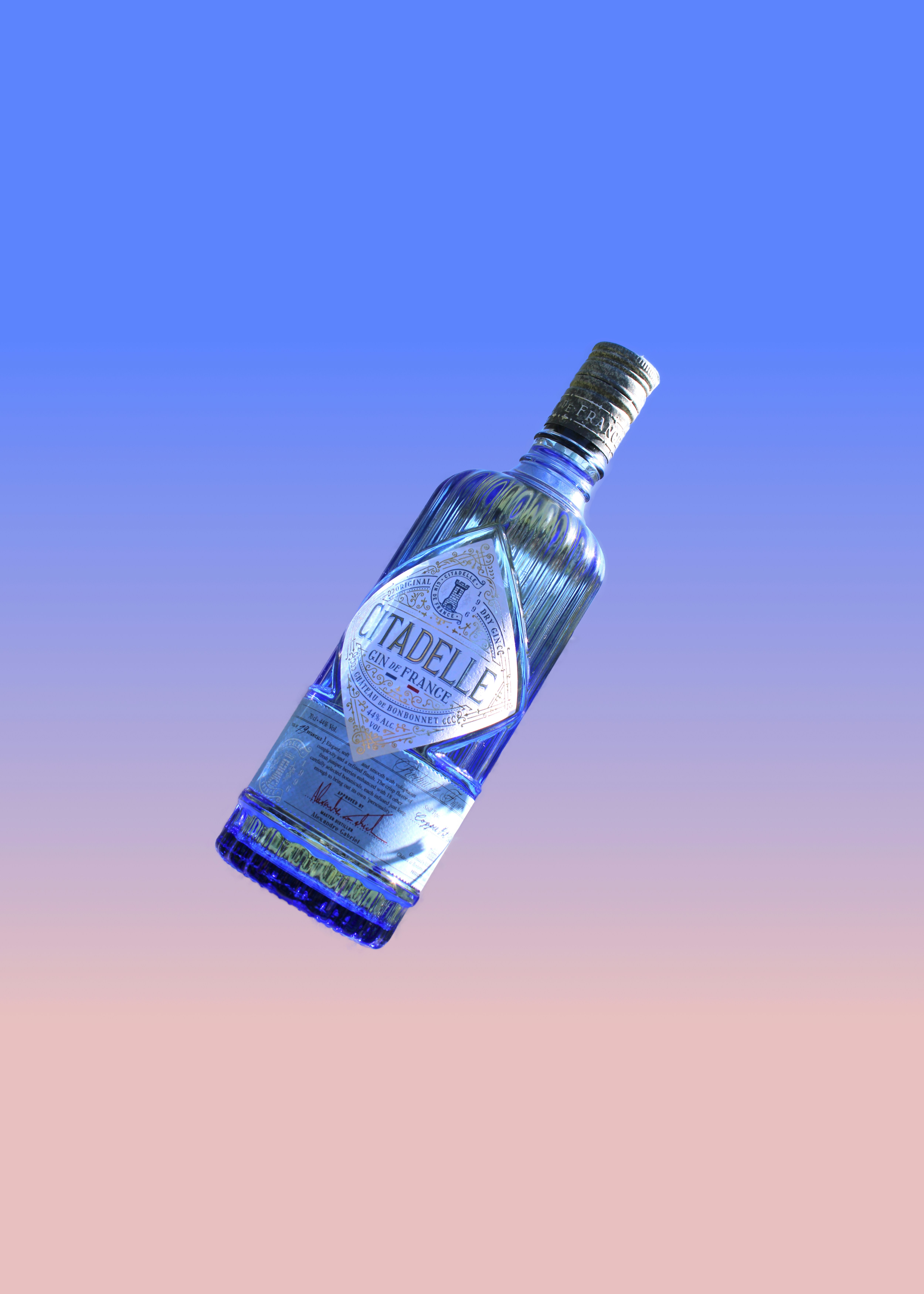 A bottle of alcohol floating in the air photo Free Sicilia Image on Unsplash