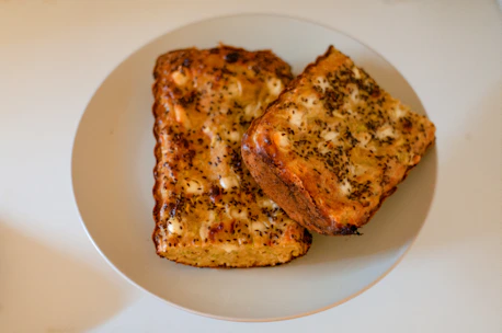 two pieces of toast on a white plate