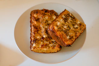 two pieces of toast on a white plate