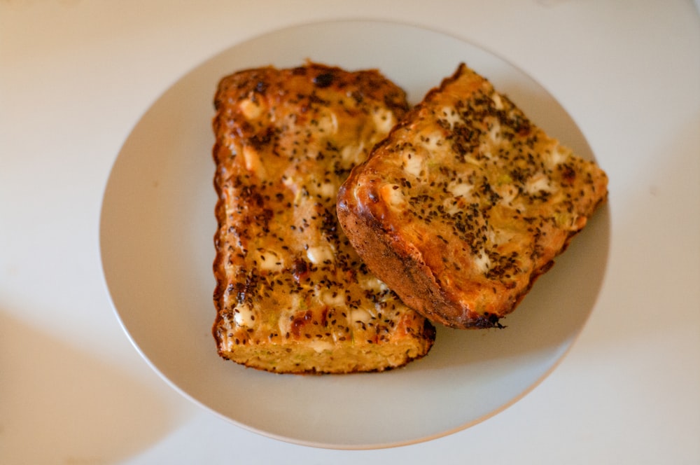 two pieces of toast on a white plate