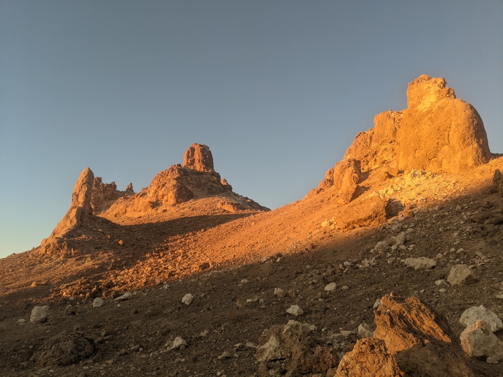 a group of rocks sitting on top of a hill