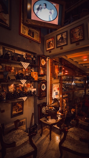 A cozy room filled with vintage decorative items like ornate vases, antique clocks, and weathered picture frames.