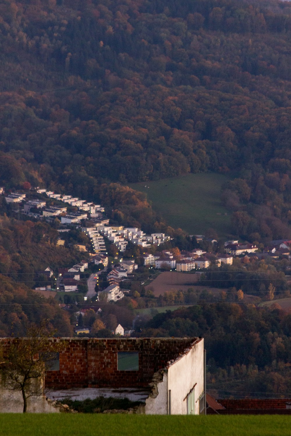 a view of a small town in the mountains