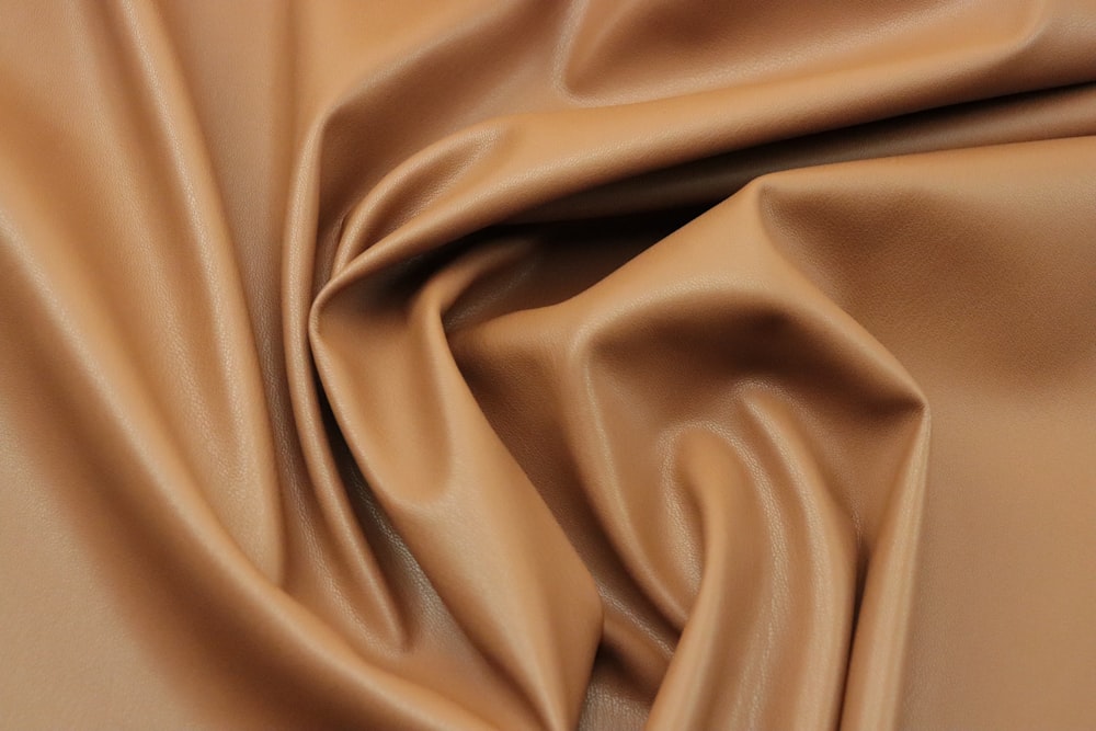 a close up of a brown leather texture