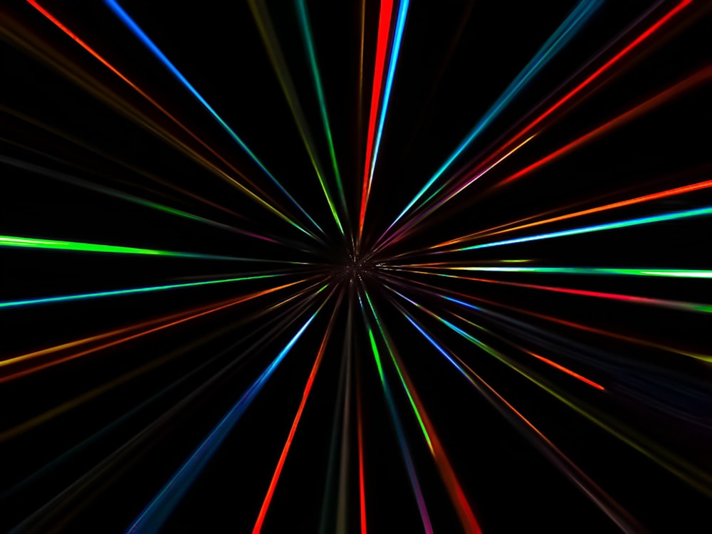 a black background with colorful lines in the middle