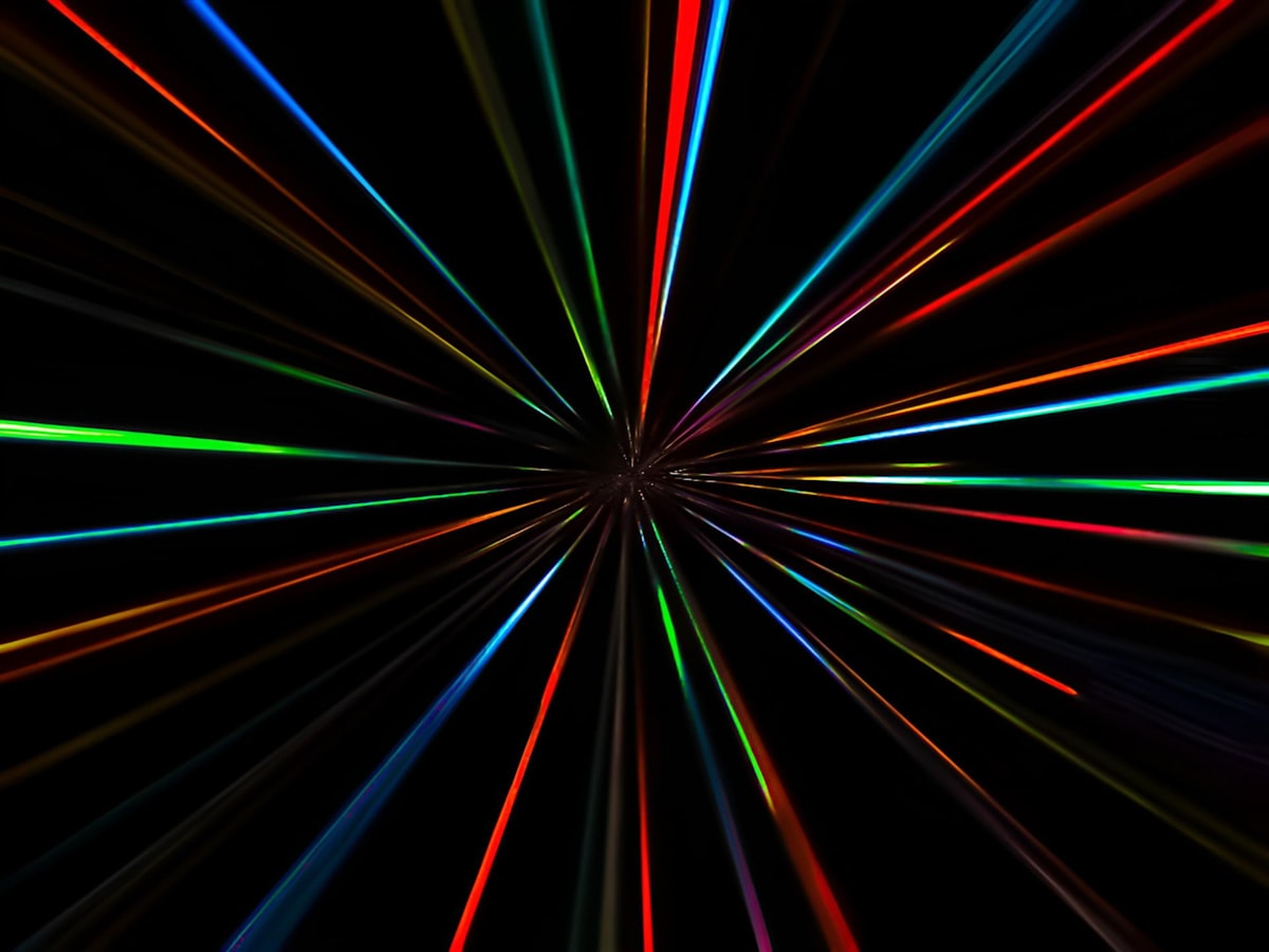 Streaks of coloured light against a black background